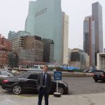 Man standing in front of the United Nations building in New York, NY